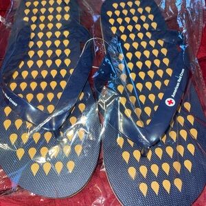 Women's Blue and Yellow flip flops size large NEW
